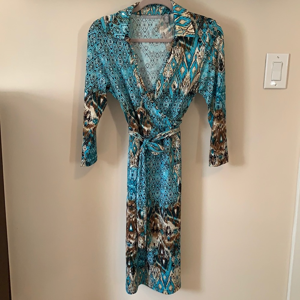 Long sleeve turquoise, tan and brown dress.